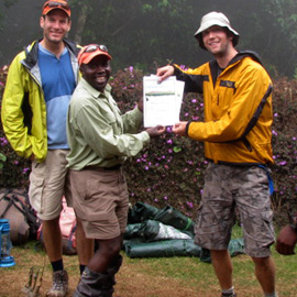 accomplishing the peak of kilimanjaro